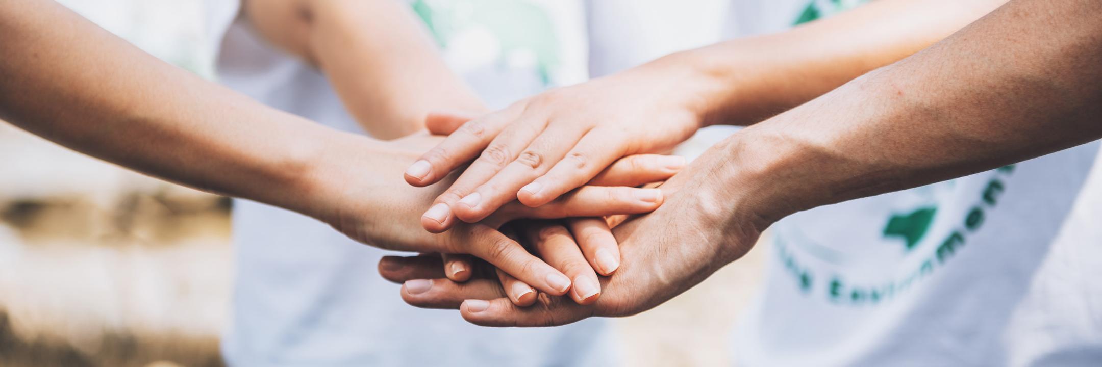 Binastra Land team joining hands in a community effort